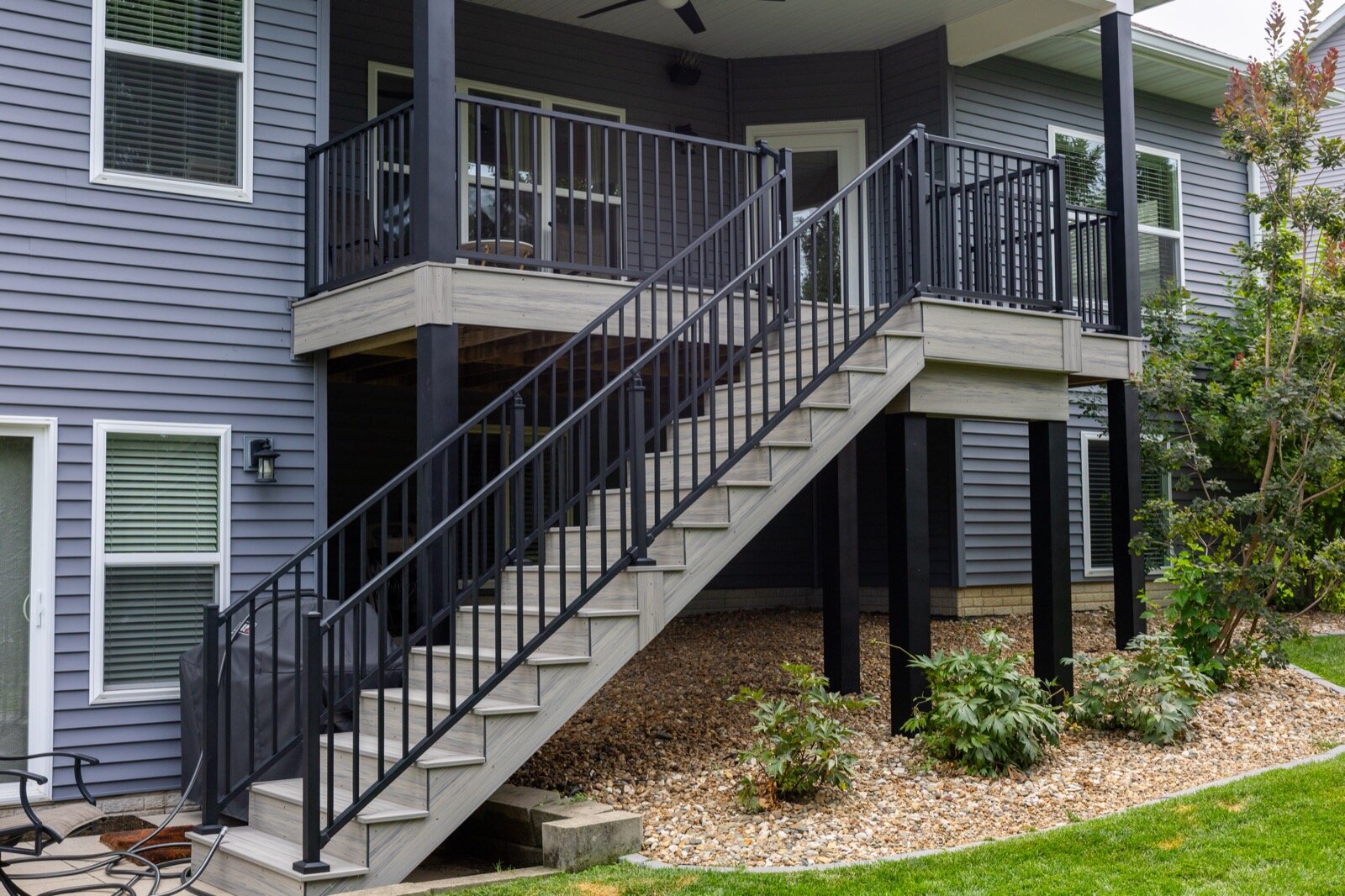 Composite deck stairs with aluminum railing in North Liberty Iowa