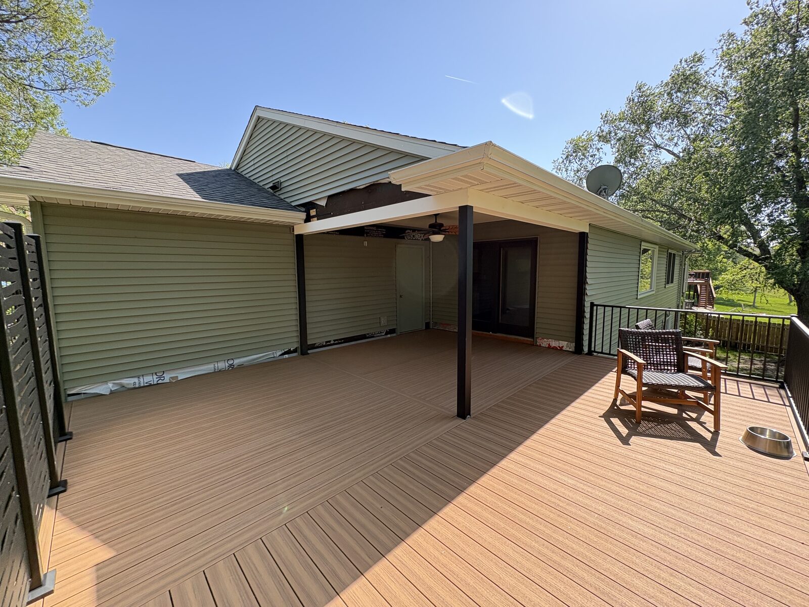 Large covered deck with composite decking and ceiling fan, Iowa City deck contractor